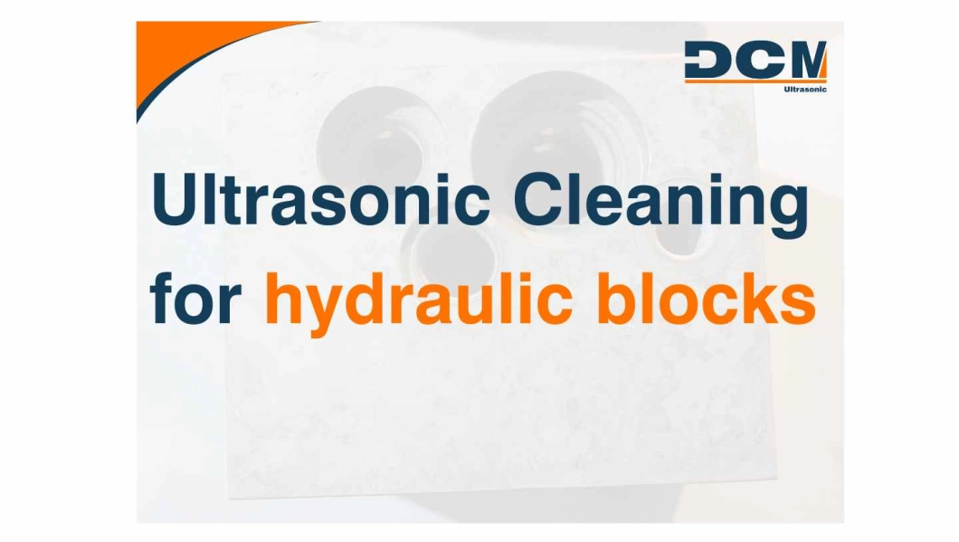 Hydraulic block cleaning with ultrasound hydraulic block cleaning