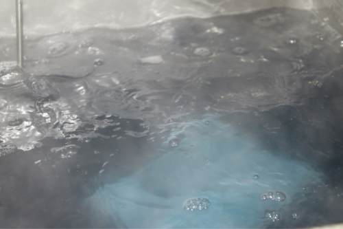 removing machining debris with an ultrasonic bath